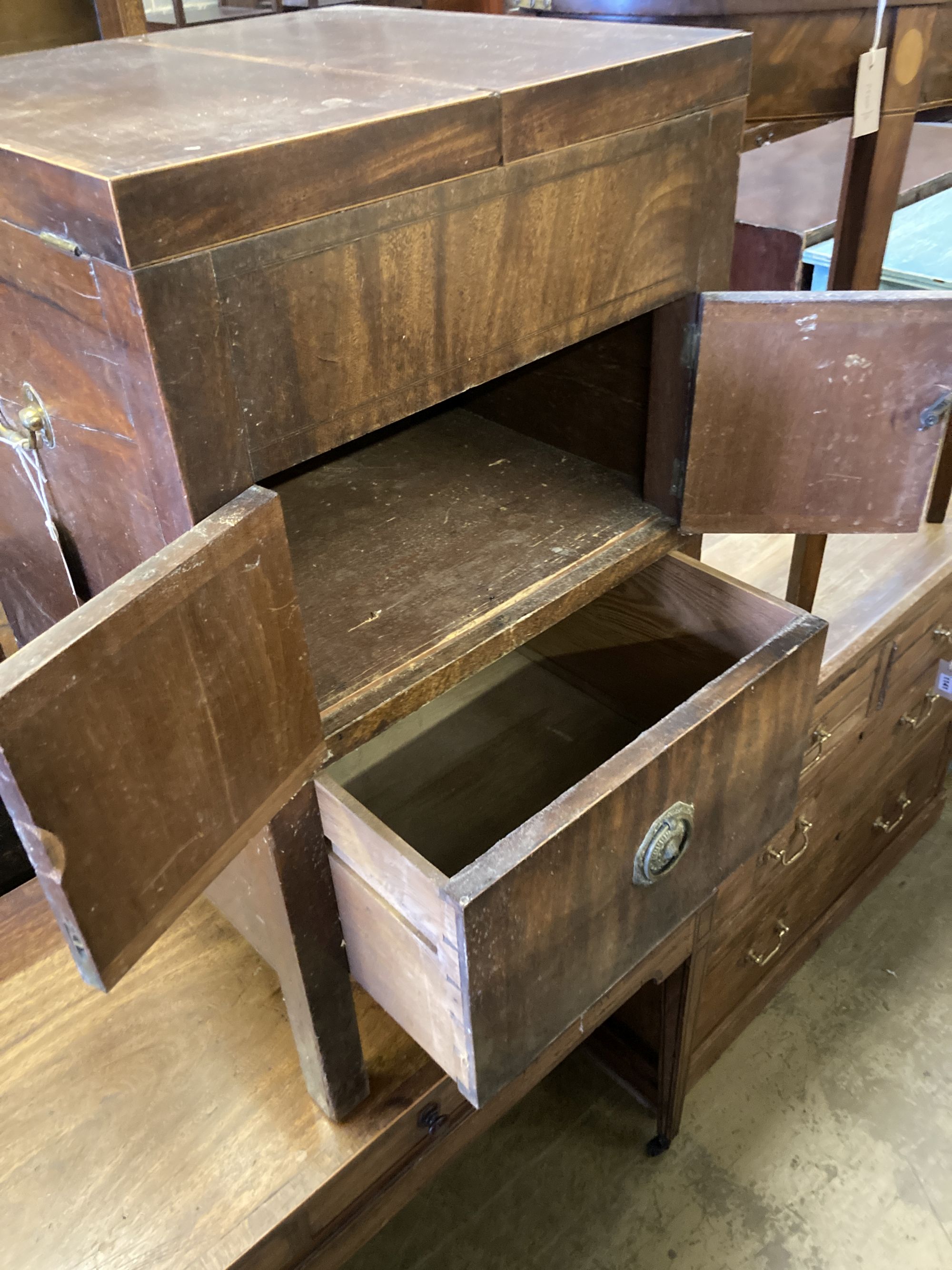 A George III cross banded mahogany enclosed wash stand, width 48cm, depth 46cm, height 79cm